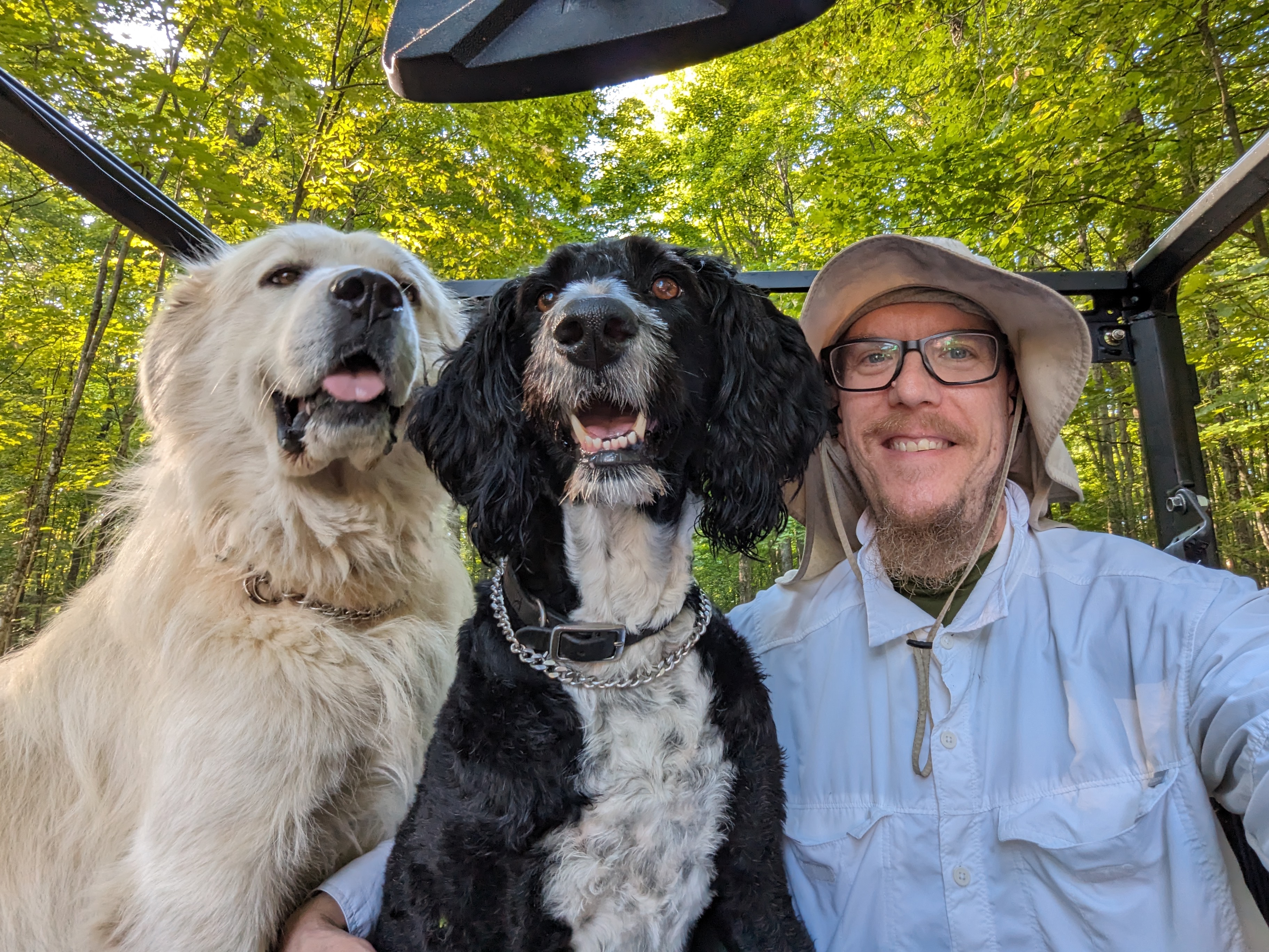 Jesse Hirsh speaking on stage in front of a projected city skyline and his name.